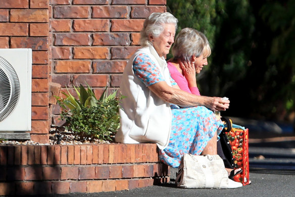 Residents are seen outside the Earle Haven Nursing Home following its shock closure last week.