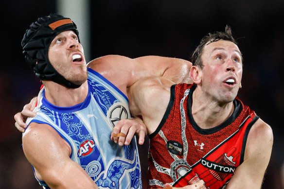 North’s Tristan Xerri goes up in the ruck against his former mentor, Todd Goldstein, now with the Bombers.