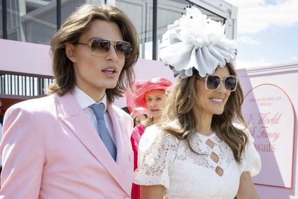 Look yes, talk no: Liz Hurley and son Damian at Oaks Day.