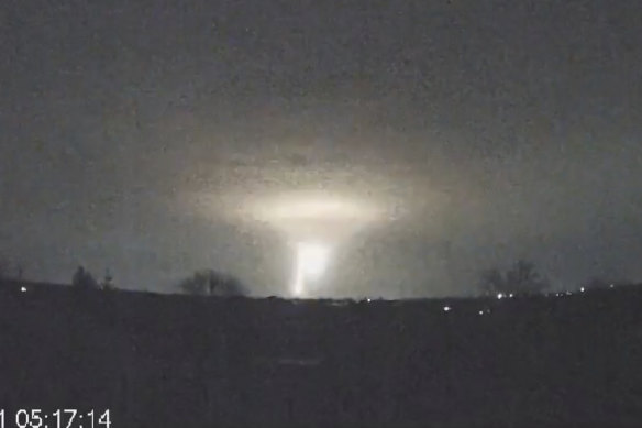 In this screen grab from a video provided by the Come Back Alive Foundation, lights are seen in the sky during a Russian attack on Dnipro, Ukraine. 