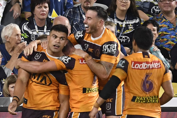 David Fifita celebrates with his Broncos teammates after scoring a try against the Queensland Cowboys in March.