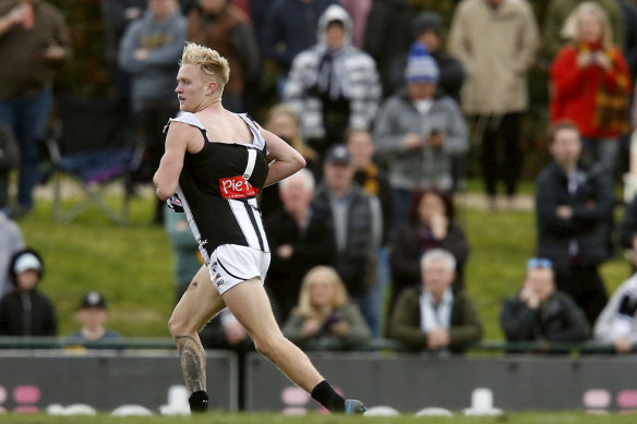 Collingwood's Jaidyn Stephenson has his guernsey torn in a melee against Box Hill in the VFL on Saturday.