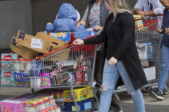 Shoppers stock up on supplies amid  the uncertainty over the coronavirus threat.

