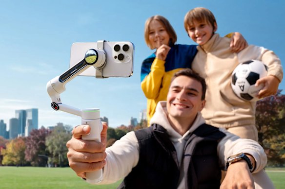 Is it weird to hold a robot arm with your arm while it holds your phone? Yeah. But it has spinnier joints than you.
