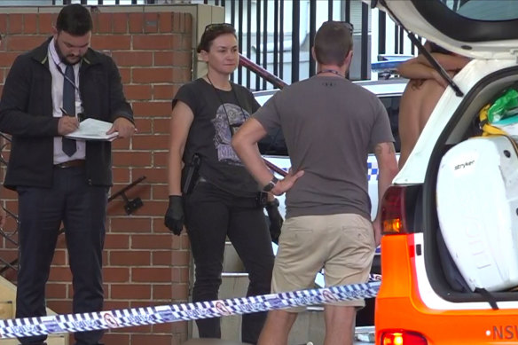 Police at the crime scene outside Blacktown Police Station.