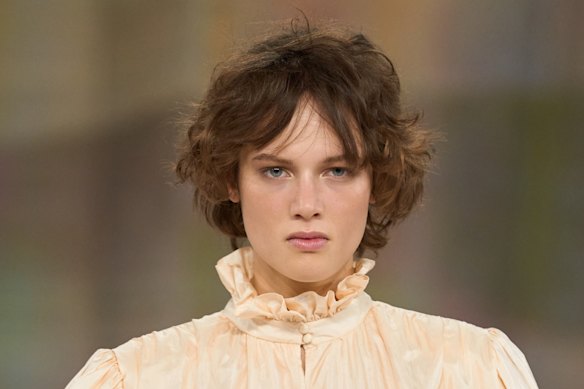 Shaggy bohemian fringes with a “grown out” feel on the Chloé Fall/Winter 2026 runway.