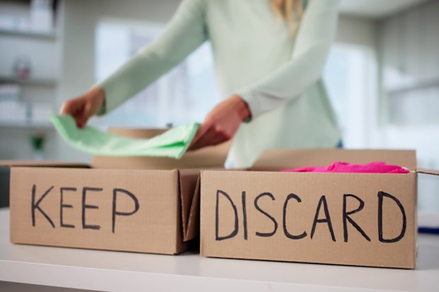 Decluttering items by sorting into keep and discard piles