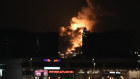 Fire form a oil depot lights the sky over Jiddah, Saudi Arabia, Friday, March 26, 2022.