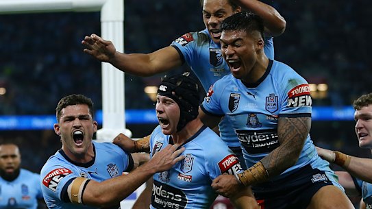 Matt Burton celebrates his try on debut for NSW.