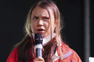 Greta Thunberg addresses protesters outside the climate summit in Glasgow on Friday, local time.