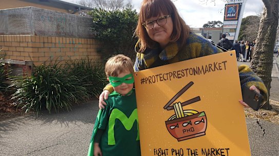 Protesters Kersti Skinner and four-year-old Jude, aka Market Man, at a demonstration at Preston Market on Saturday.
