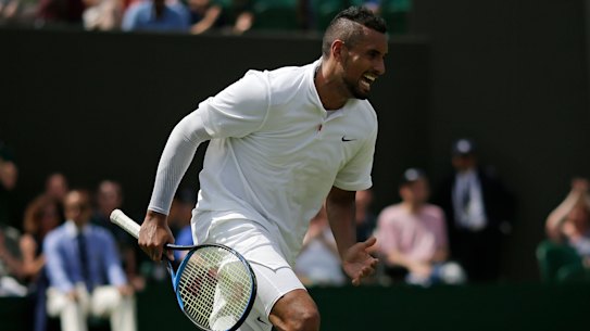 Australia's Nick Kyrgios celebrates winning a point in a tie-break during his Men's singles match against Australia's Jordan Thompson on day two of the Wimbledon Tennis Championships in London, Tuesday, July 2, 2019. (AP Photo/Tim Ireland)