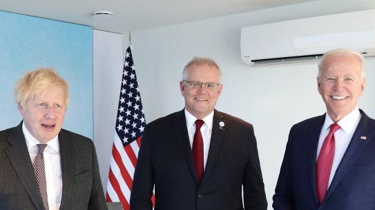 Britain’s Prime Minister Boris Johnson with Scott Morrison and US President Joe Biden at the G7 summit. 