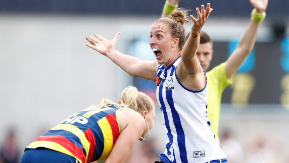 Emma King celebrates North Melbourne’s dramatic one-point win in the preliminary final against Adelaide.