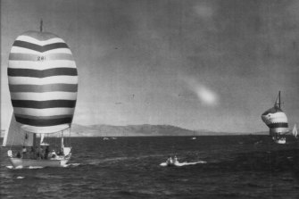 American yawl Ondine, with her spinnaker full crosses the finishing line in Sydney-Hobart yacht race.