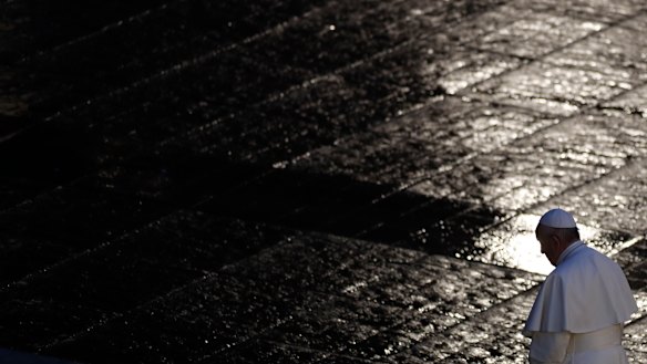 Pope Francis walks during Urbi and Orbi prayer in an empty St. Peter's Square, at the Vatican last weekend.