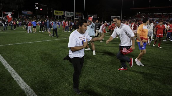 Fans storm the field after the clash between Tonga and Samoa at Penrith in 2013 - before the full-time whistle.