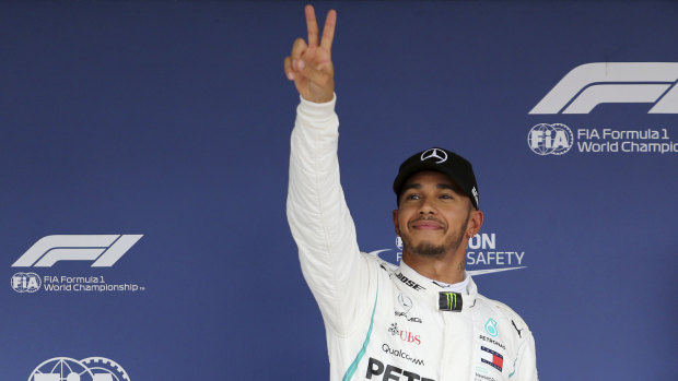 Salute: Lewis Hamilton is on pole as he seeks another victory in Japan.
