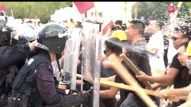 Shenzhen anti-riot police crack down on a simulated protest at Waterfront Square on Tuesday.