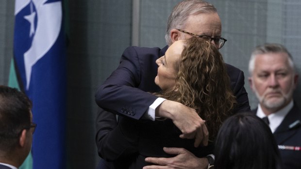 Prime Minister Anthony Albanese embraces Doyle after her speech.