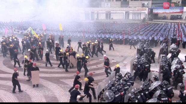 Shenzhen anti-riot police in formation during a simulated protest drill at Waterfront Square on Tuesday.