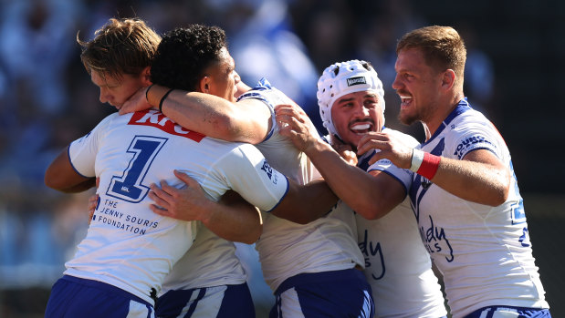 The Bulldogs celebrate Hayze Perham’s first try.