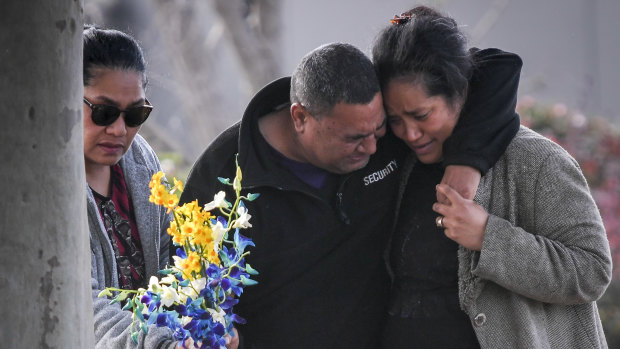 Solomone's parents Salome (right) and 'Atunaisa (centre) visit the scene where their son was killed.