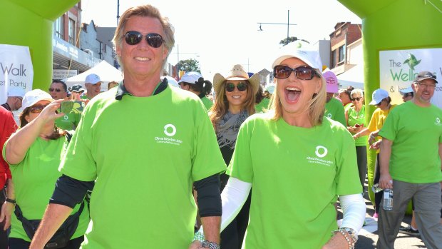Newton-John with her husband John Easterling at the start of the Wellness walk in 2014.