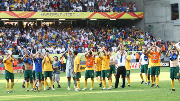 The Socceroos thank their supporters after losing to Italy in the World Cup.