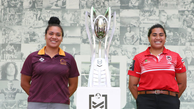 Brisbane captain Amber Hall and Feterika with the NRLW trophy on Friday.