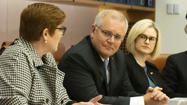Minister for Women Marise Payne and PM Scott Morrison with Assistant Minister to the Attorney-General Amanda Stoker (right), who says there is “more than one way to skin a cat” on ending sexual harassment.