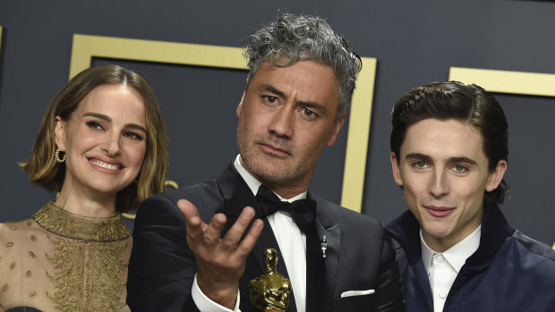 Natalie Portman with Taika Waititi, winner of the award for best adapted screenplay for "Jojo Rabbit", and Timothee Chalamet.