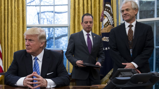 Peter Navarro (far right) in the Oval Office with President Donald Trump and then White House chief of staff Reince Priebus.