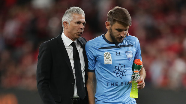 Steve Corica and Milos Ninkovic come to terms with defeat in the derby in October.