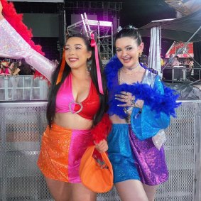 Sam Todd (right) wearing one of her designs at Harry Styles’ concert on the Gold Coast.