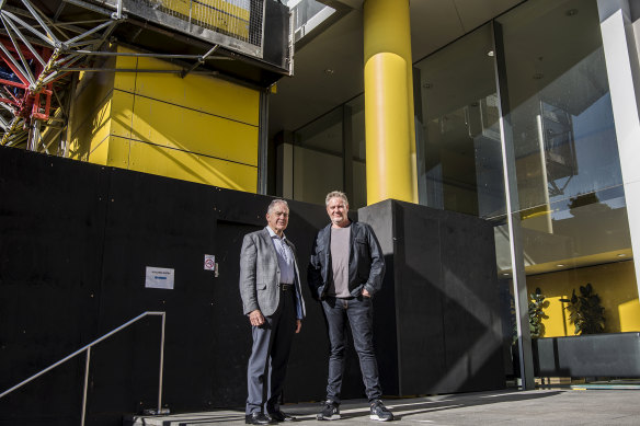 Apartment owners Colin Knowles, left, and Matthew Summerill say the state government should help pay for cladding removal.