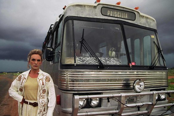 Terence Stamp as Bernadette beside Priscilla the bus in the 1994 Australian film The Adventures of Priscilla, Queen of the Desert.