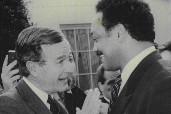 Newly elected president George H.W. Bush holds an animated discussion with Jackson at the White House in November 1988.