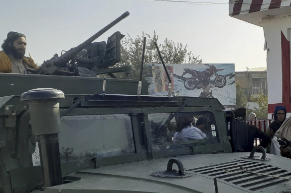 Taliban fighters stand guard in Kunduz city, northern Afghanistan, Monday, August 9, 2021. 