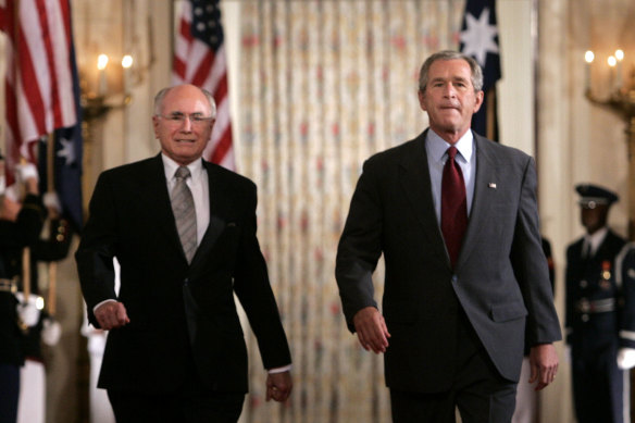 Former US president George W Bush (right) hosted former prime minister John Howard for a state dinner in 2005.