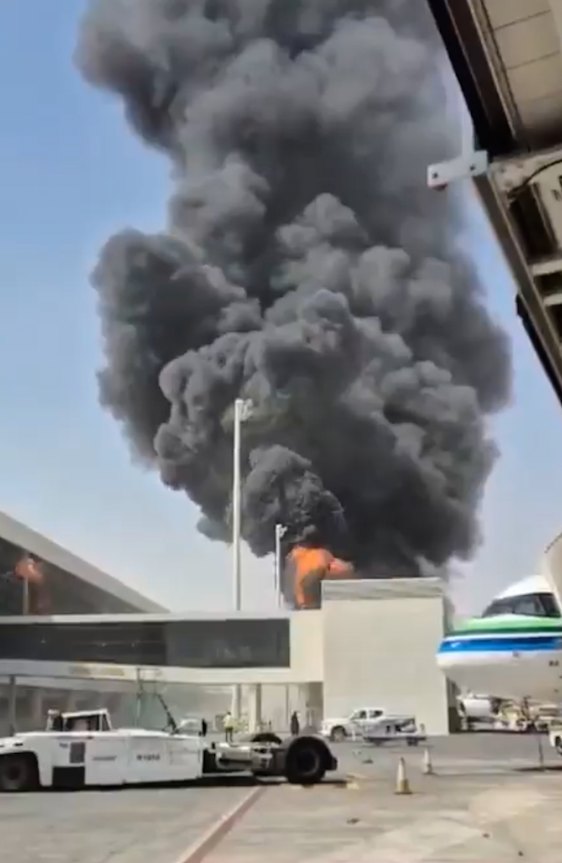 This image from video obtained and verified by AP shows thick black smoke and flames rising from a fire at King Khalid International Airport in Riyadh, Saudi Arabia, on October 9.
