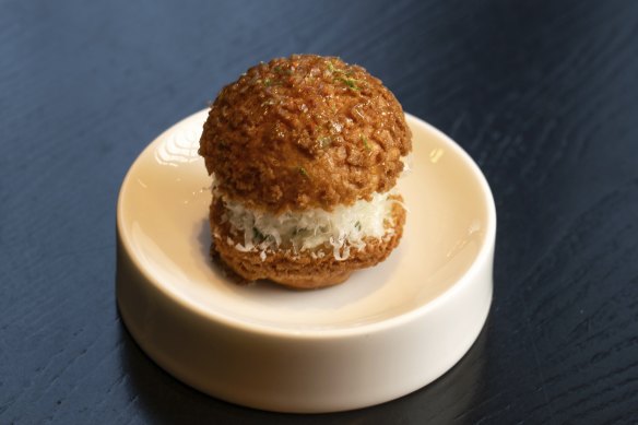 Crab, dressed with lemon, parmesan and dill, inside a choux bun.