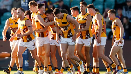 LAUNCESTON, AUSTRALIA - MAY 22: Sam Butler of the Hawks celebrates a goal with teammates during the 2022 AFL Round 10 match between the Hawthorn Hawks and the Brisbane Lions at UTAS Stadium on May 22, 2022 in Launceston, Australia. (Photo by Dylan Burns/AFL Photos via Getty Images)