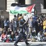 Several hundred students and pro-Palestinian supporters rally at the intersection of Grove and College Streets, in front of Woolsey Hall on the campus of Yale University in New Haven, Connecticut.