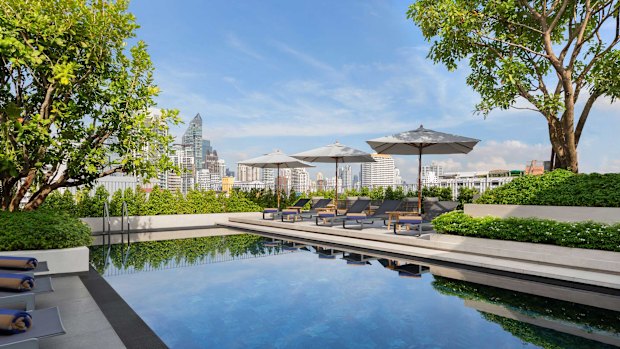 City skyline views from the rooftop pool.