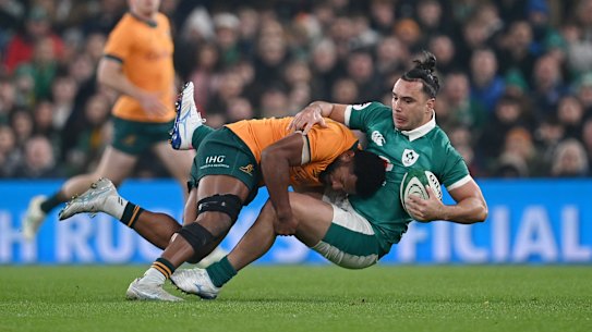 DUBLIN, IRELAND - NOVEMBER 15: James Lowe of Ireland is tackled by Filipo Daugunu of Australia during the Quilter Nations Series 2025 rugby international match between Ireland and Australia at Aviva Stadium on November 15, 2025 in Dublin, Ireland. (Photo by Charles McQuillan/Getty Images)
