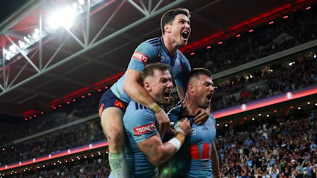 Bradman Best celebrates scoring a try for NSW.