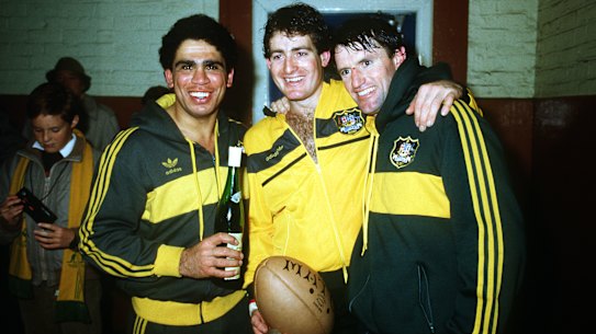 Mark Ella, David Campese and Andrew Slack celebrate after beating Scotland, and winning the Grand Slam.