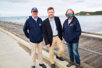 From left to right: Charles Reis of Save Flinders Pier, MP Chris Brayne, and Jo Monie, Flinders Community Association president at the Flinders pier on Wednesday. 