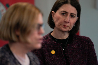 NSW Premier Gladys Berejiklian listens as Chief Health Officer Kerry Chant provides an update on COVID-19 on Friday.